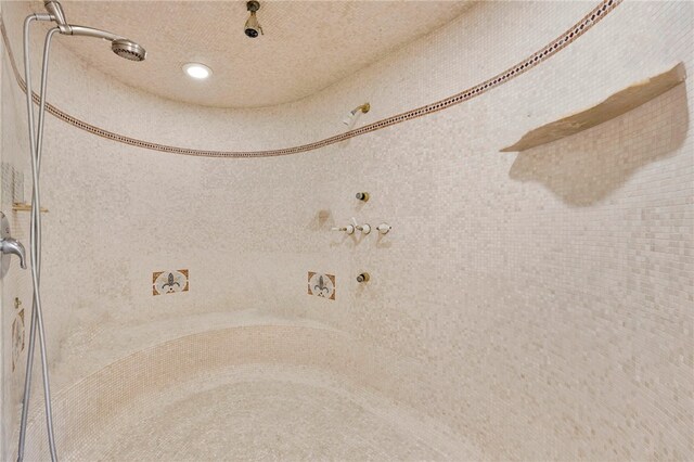 interior space featuring a tile shower