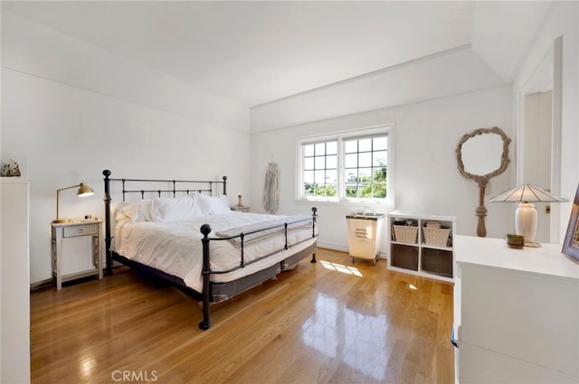 bedroom with hardwood / wood-style floors