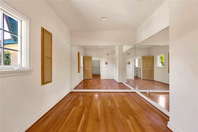 empty room featuring hardwood / wood-style floors and a wealth of natural light