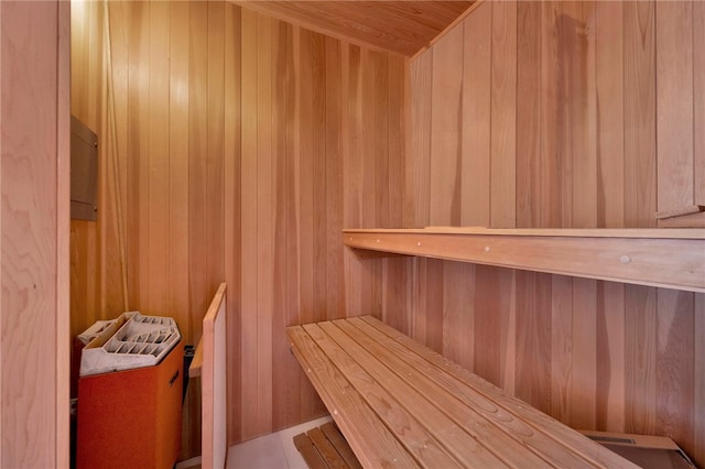 view of sauna / steam room with wood ceiling and wood walls