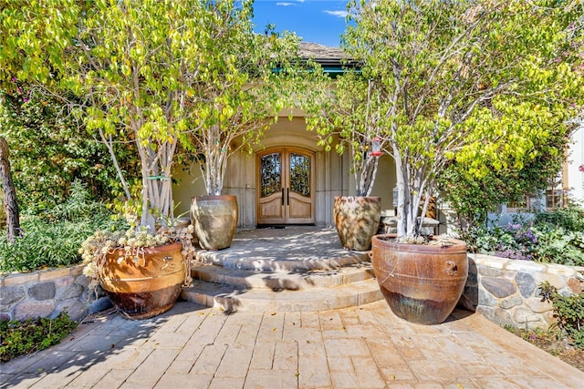 property entrance featuring french doors