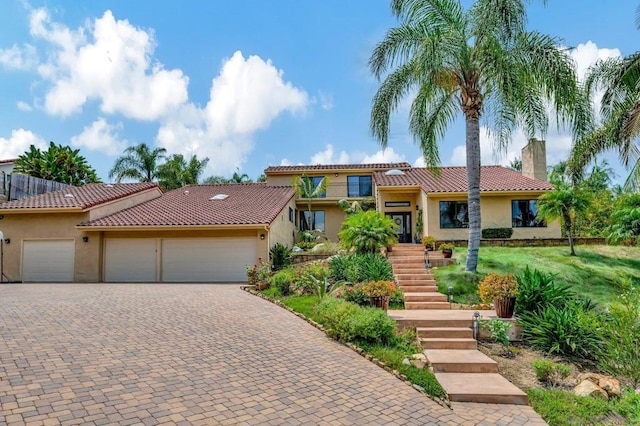 mediterranean / spanish-style house featuring a garage