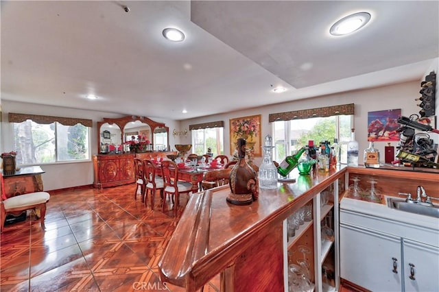 kitchen with sink, tile patterned floors, and a healthy amount of sunlight