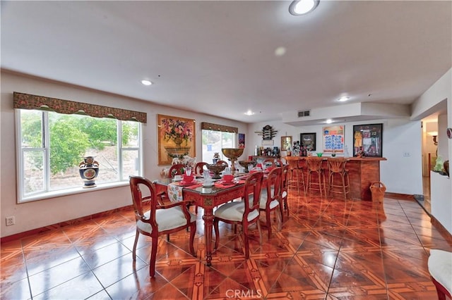 dining area featuring bar