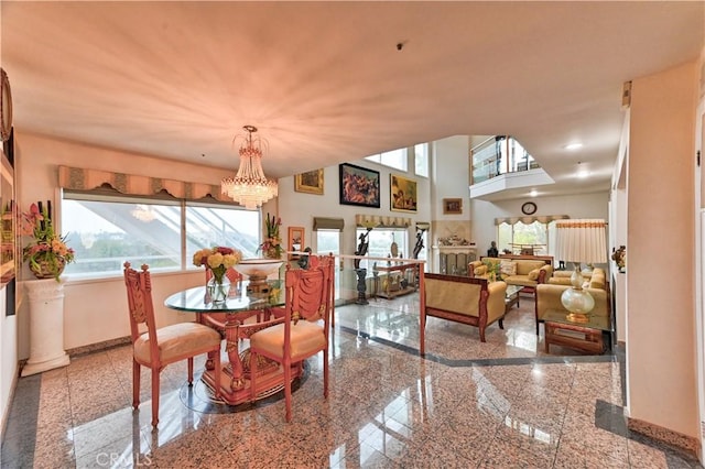 dining space featuring an inviting chandelier