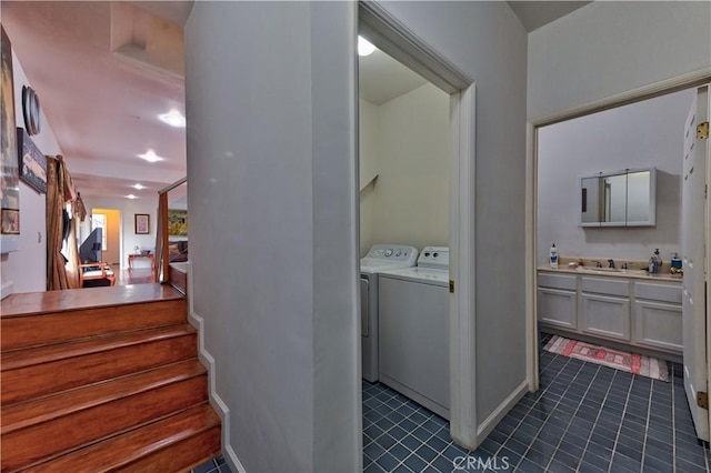 washroom featuring independent washer and dryer and sink