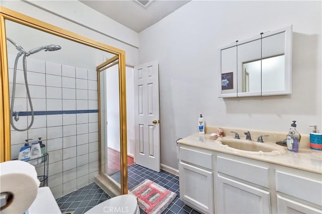 bathroom featuring tile patterned floors, walk in shower, toilet, and vanity