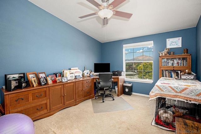 carpeted office with ceiling fan and vaulted ceiling