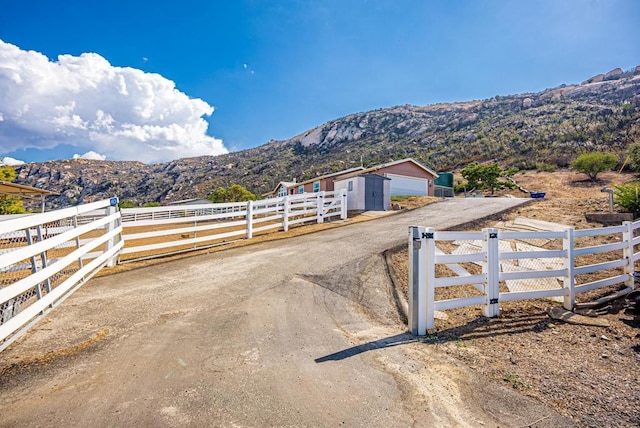 view of street featuring a mountain view and a rural view