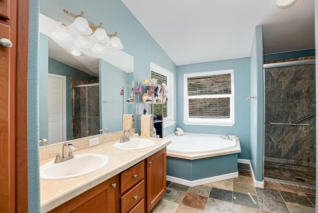 bathroom with lofted ceiling, vanity, and plus walk in shower