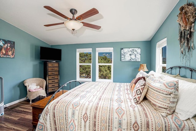 bedroom featuring lofted ceiling, ceiling fan, and dark hardwood / wood-style flooring