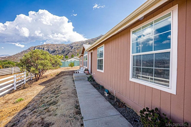 view of side of property with a mountain view