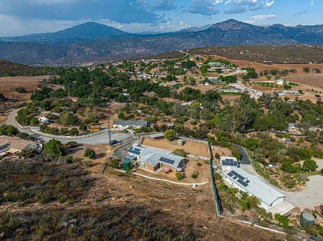 birds eye view of property with a mountain view