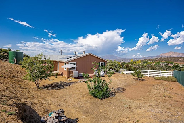 view of yard with a mountain view and an outbuilding