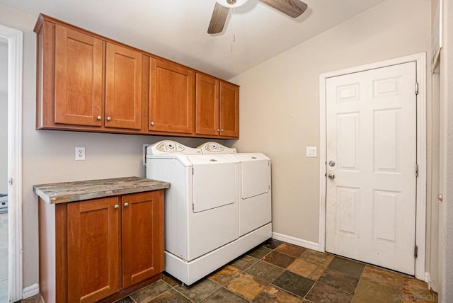 laundry area with ceiling fan, cabinets, and washing machine and dryer