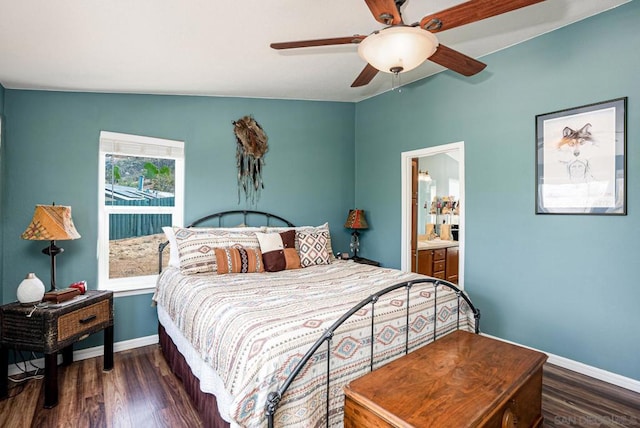 bedroom featuring ceiling fan, lofted ceiling, connected bathroom, and dark wood-type flooring