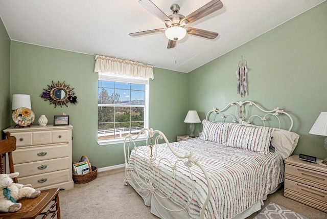 bedroom with light carpet and ceiling fan