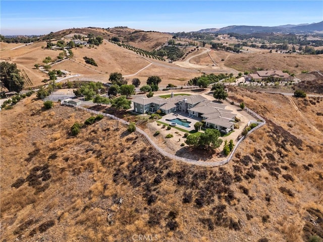 aerial view featuring a mountain view and a rural view