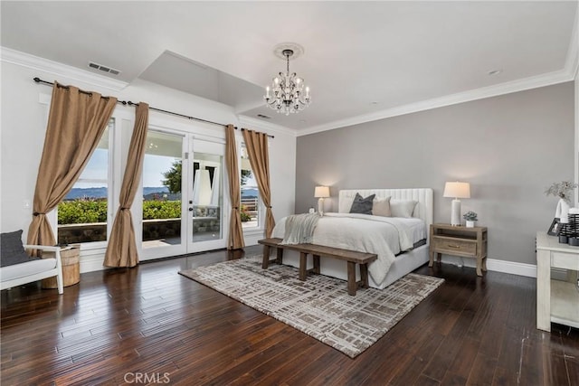 bedroom with dark wood-type flooring, access to outside, crown molding, and visible vents