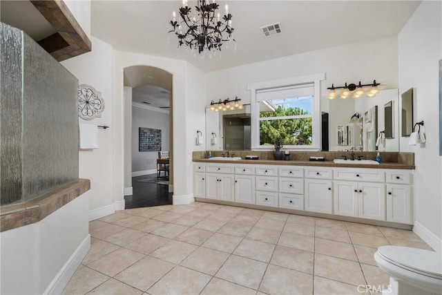 full bath featuring visible vents, a sink, tile patterned flooring, double vanity, and a chandelier