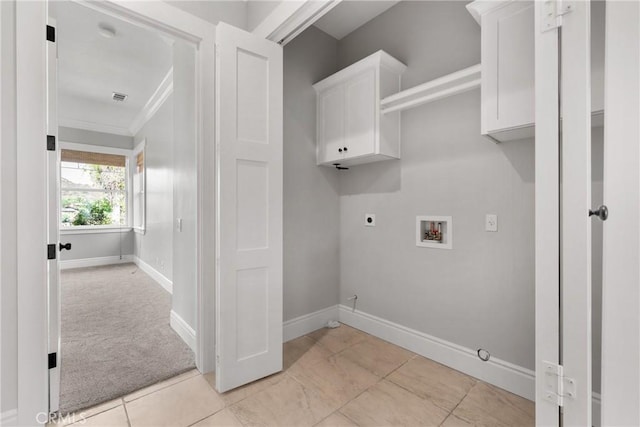 clothes washing area featuring visible vents, baseboards, washer hookup, cabinet space, and electric dryer hookup