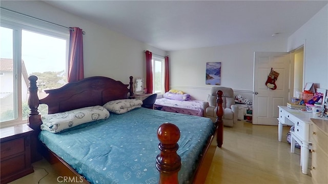 bedroom with light wood-type flooring