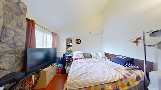 bedroom featuring lofted ceiling and hardwood / wood-style floors