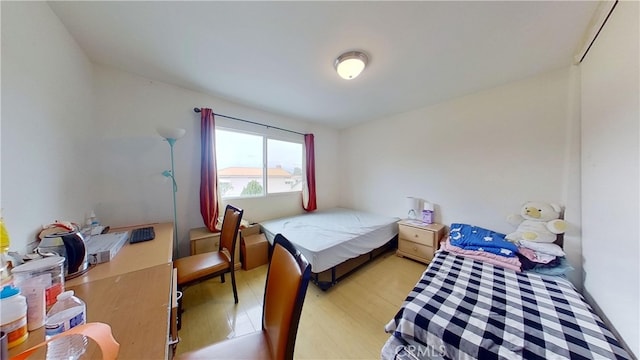 bedroom with light hardwood / wood-style floors