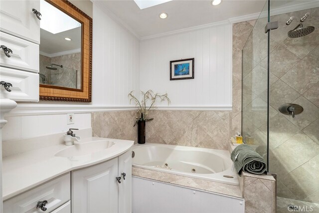 bathroom with crown molding, vanity, and separate shower and tub