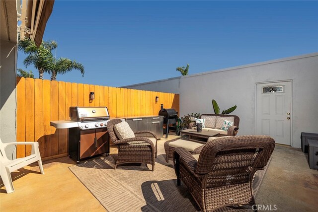 view of patio featuring grilling area and outdoor lounge area