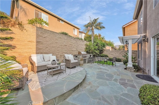 view of patio with outdoor lounge area and area for grilling