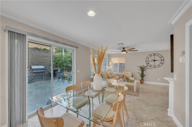 dining room featuring ceiling fan and ornamental molding