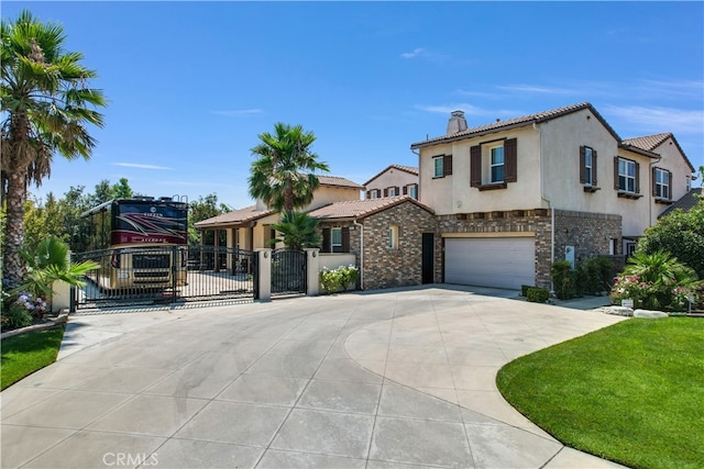 mediterranean / spanish house featuring a garage and a front lawn