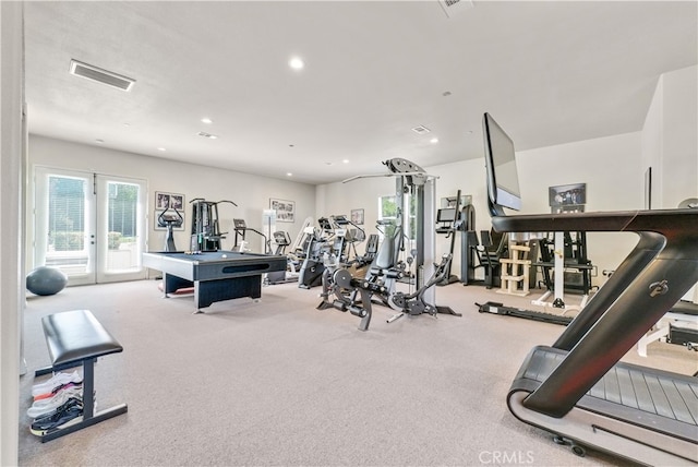 exercise room featuring french doors