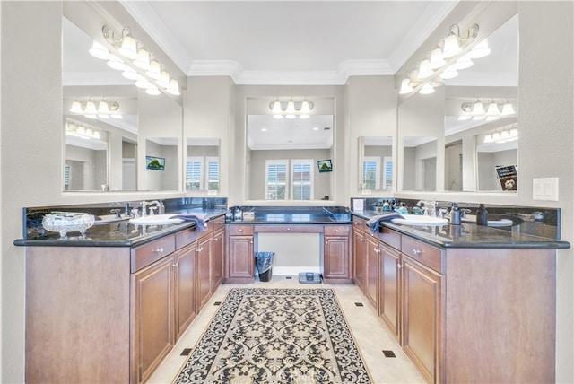 bathroom featuring tile patterned flooring, crown molding, and vanity