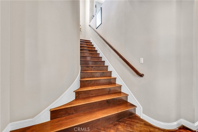 staircase featuring hardwood / wood-style floors