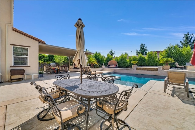 view of swimming pool featuring a patio