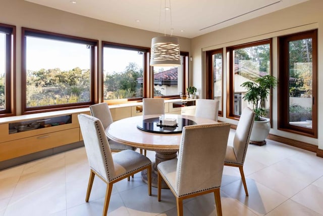 dining area with light tile patterned flooring