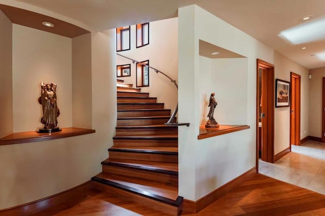 stairway with wood-type flooring