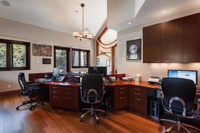 office with an inviting chandelier and dark hardwood / wood-style floors