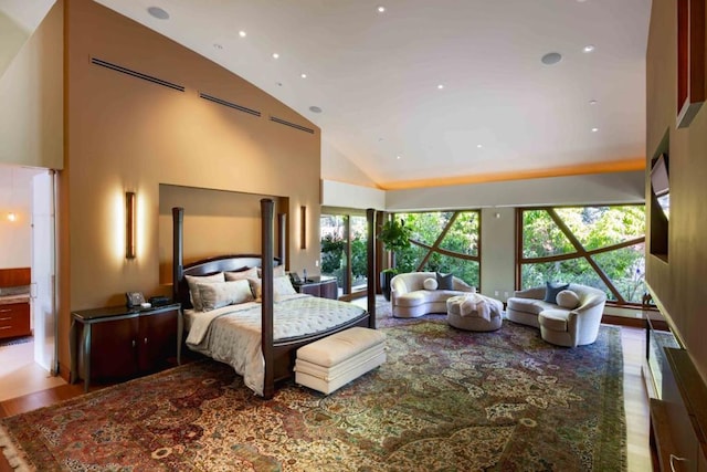 bedroom featuring high vaulted ceiling