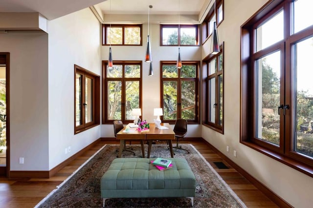 unfurnished sunroom with french doors