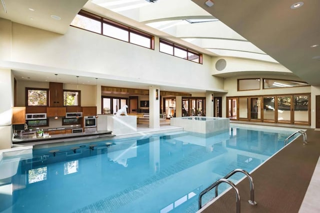 view of pool featuring a skylight