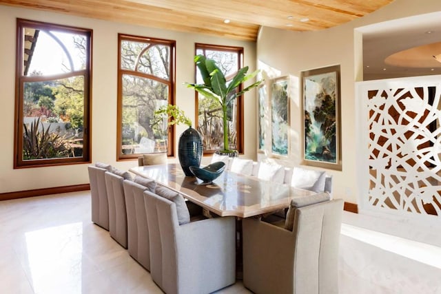 dining room with wood ceiling and beam ceiling