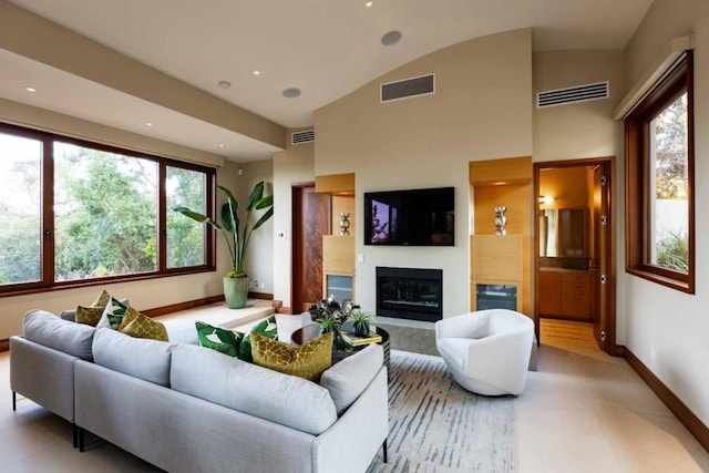 living room featuring vaulted ceiling