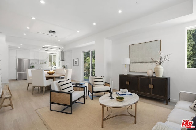 living room with light hardwood / wood-style flooring