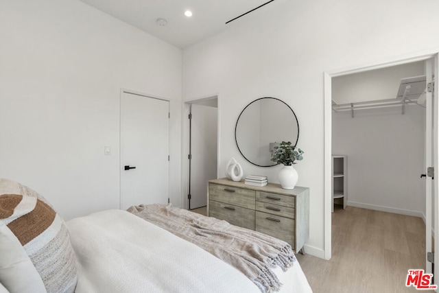 bedroom with light hardwood / wood-style flooring