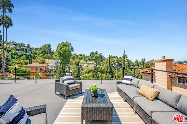 view of patio with a balcony and an outdoor hangout area