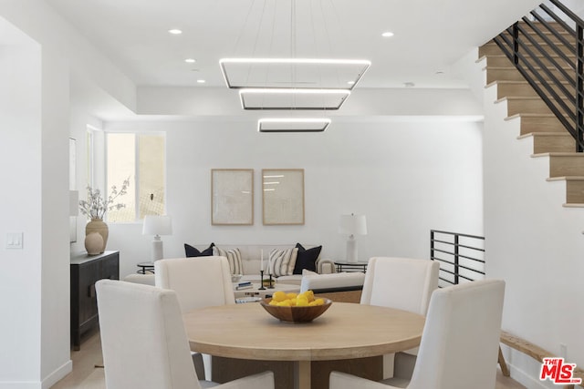 dining space with an inviting chandelier