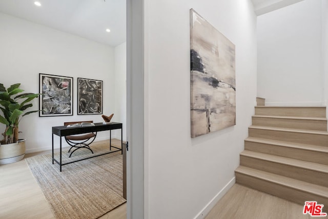 stairs with hardwood / wood-style floors